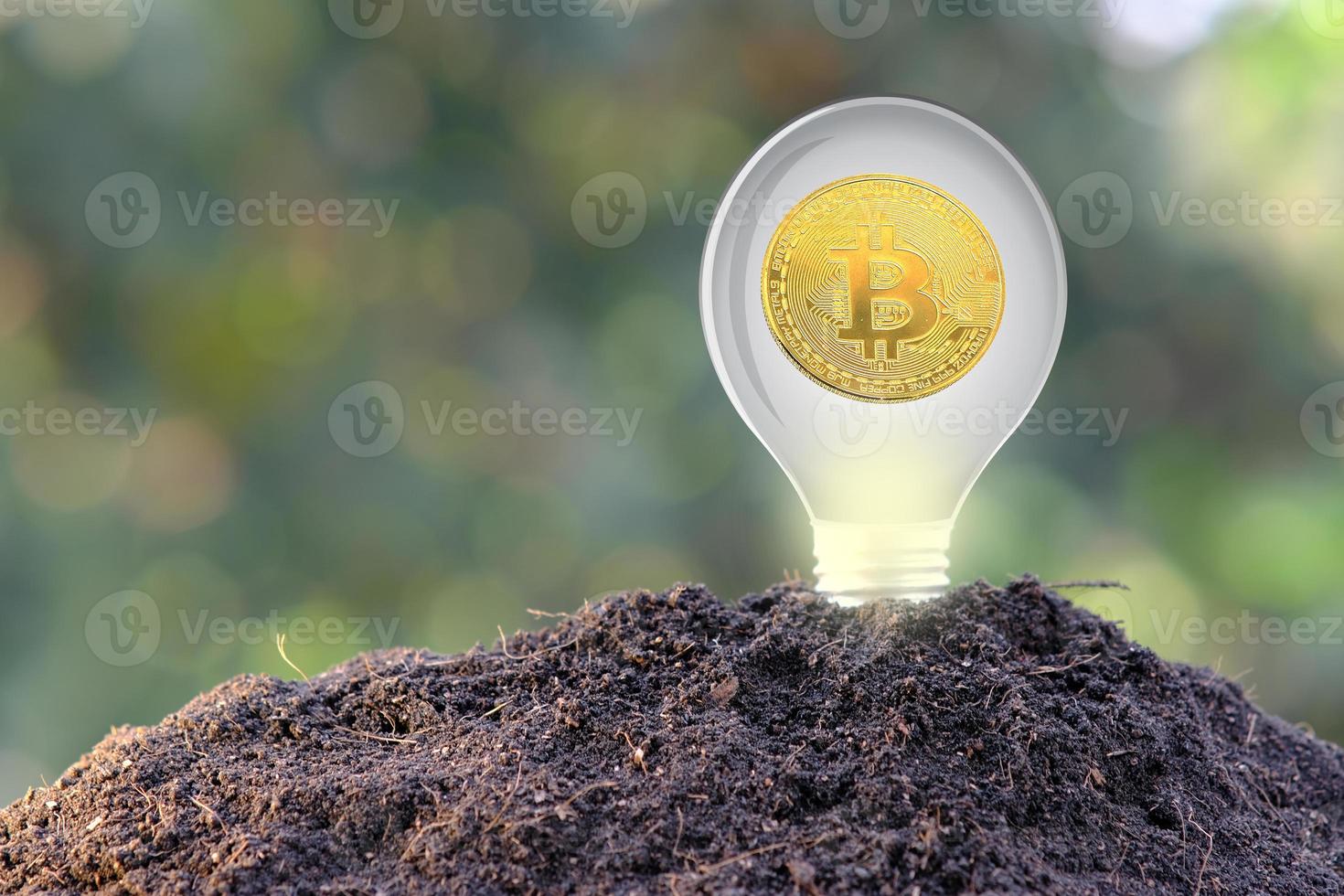 Bitcoin cryptocurrency coin and euro coin on soil, concept photo