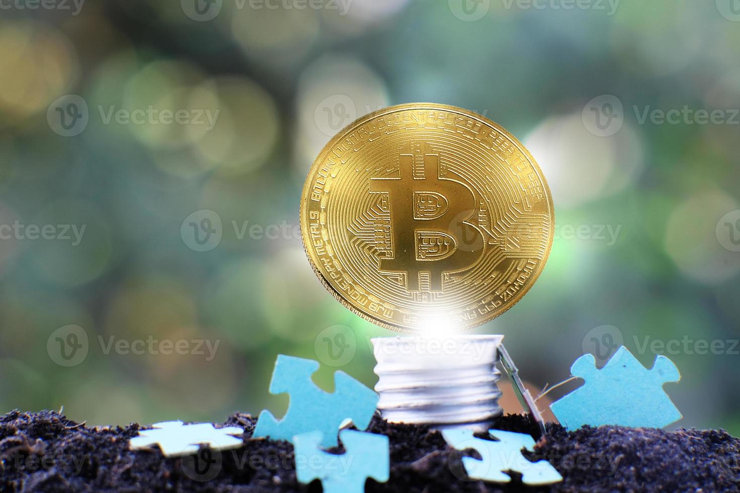 Bitcoin cryptocurrency coin and euro coin on soil, concept photo