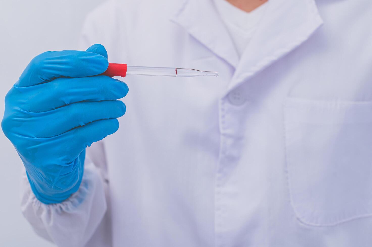 A doctor or scientist experimenting with a vaccine against diseases and illnesses photo