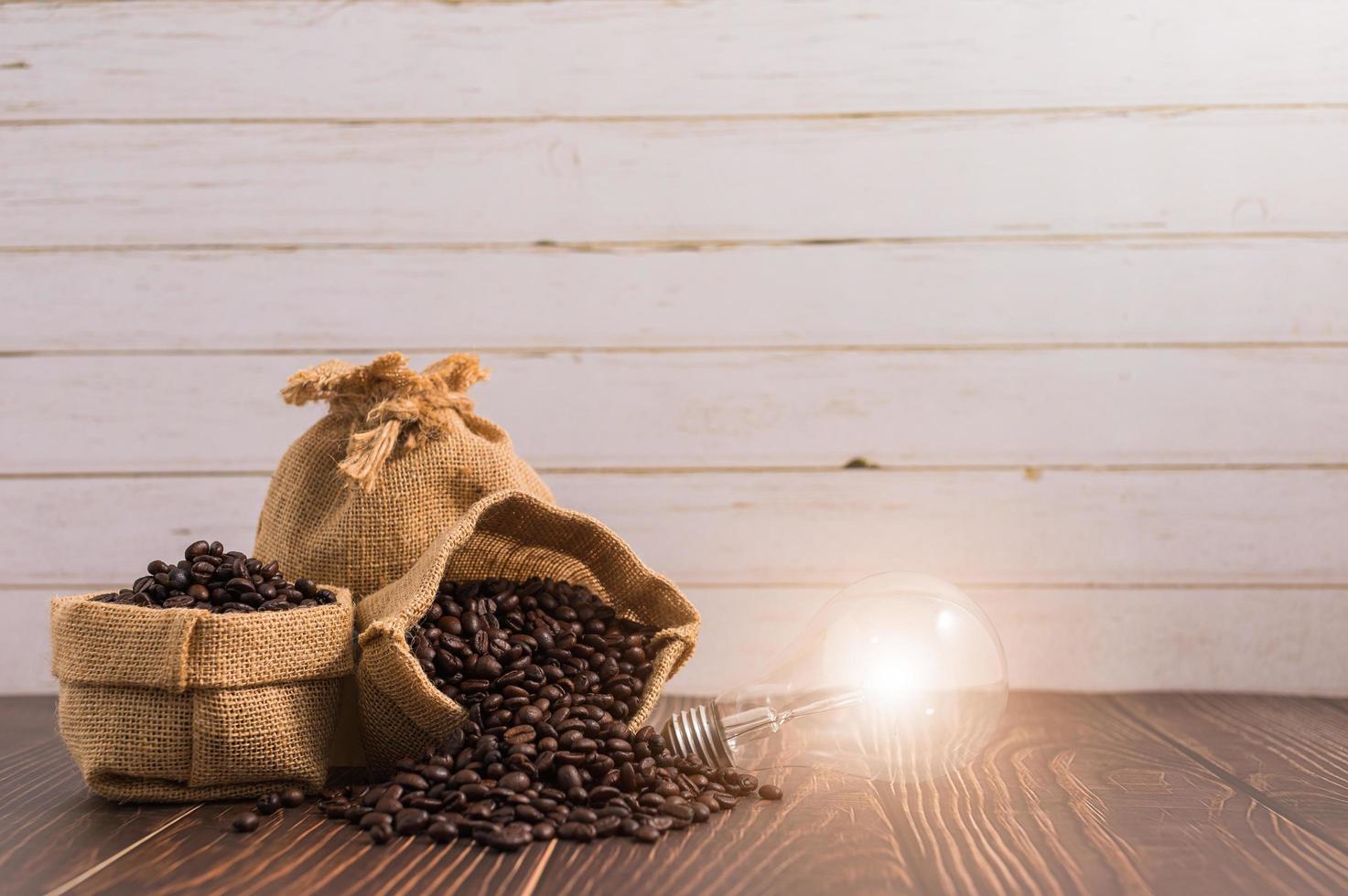 Bags of coffee beans on a wooden table photo