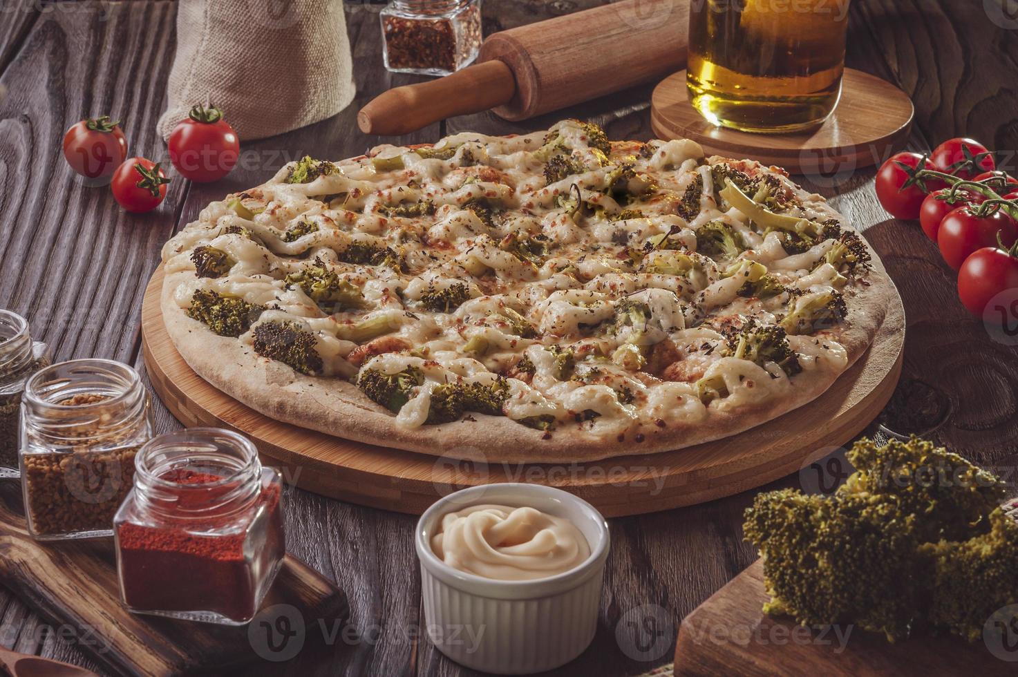 Brazilian pizza with mozzarella, broccoli, catupiry and parmesan photo