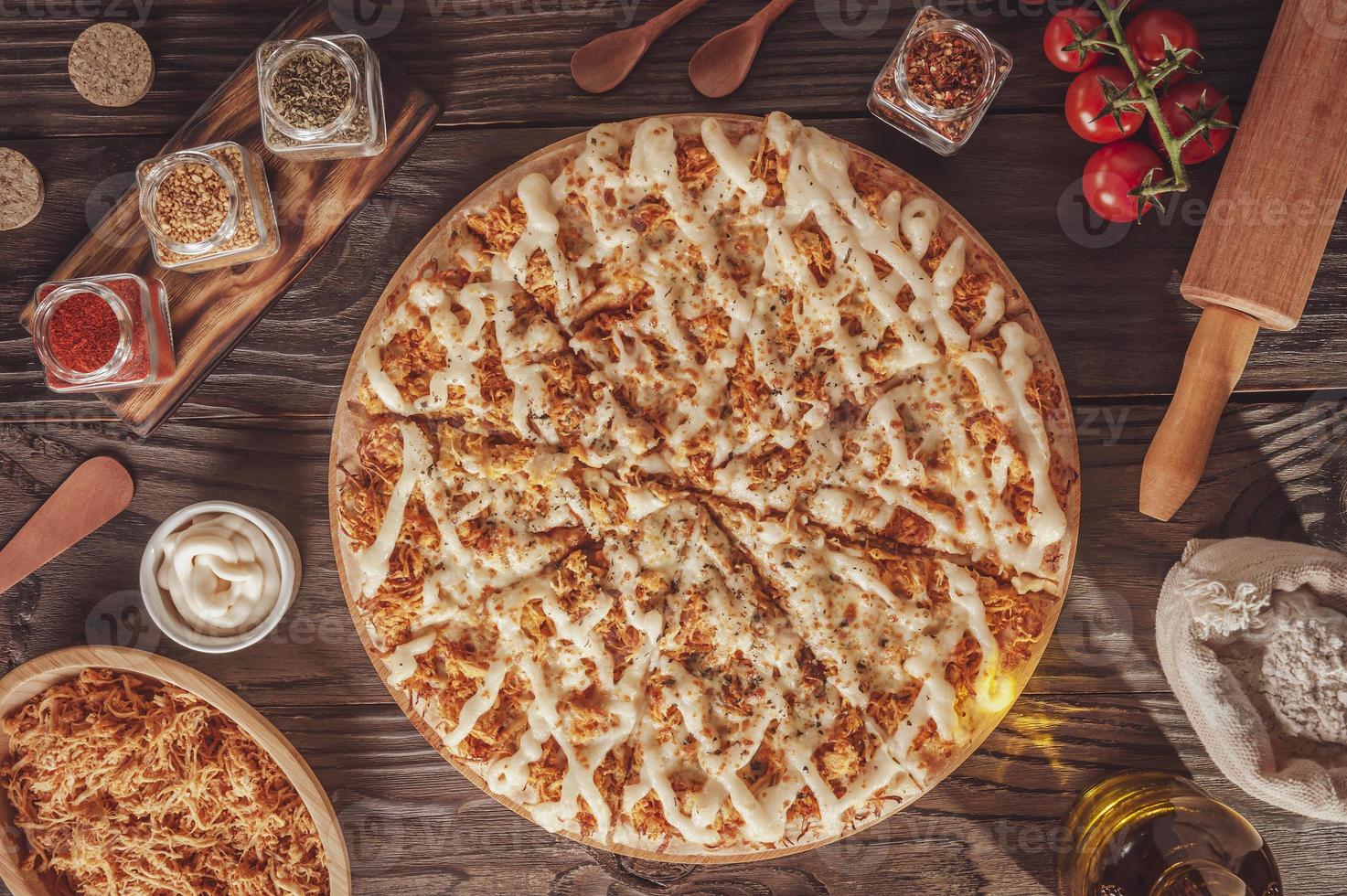 Pizza with mozzarella, chicken, catupiry and oregano photo