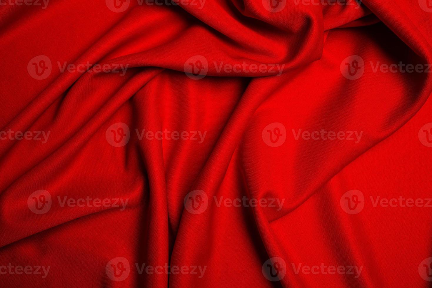 Red silk folded fabric background photo