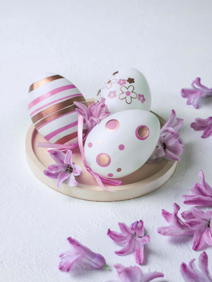 Easter background with eggs and flowers photo