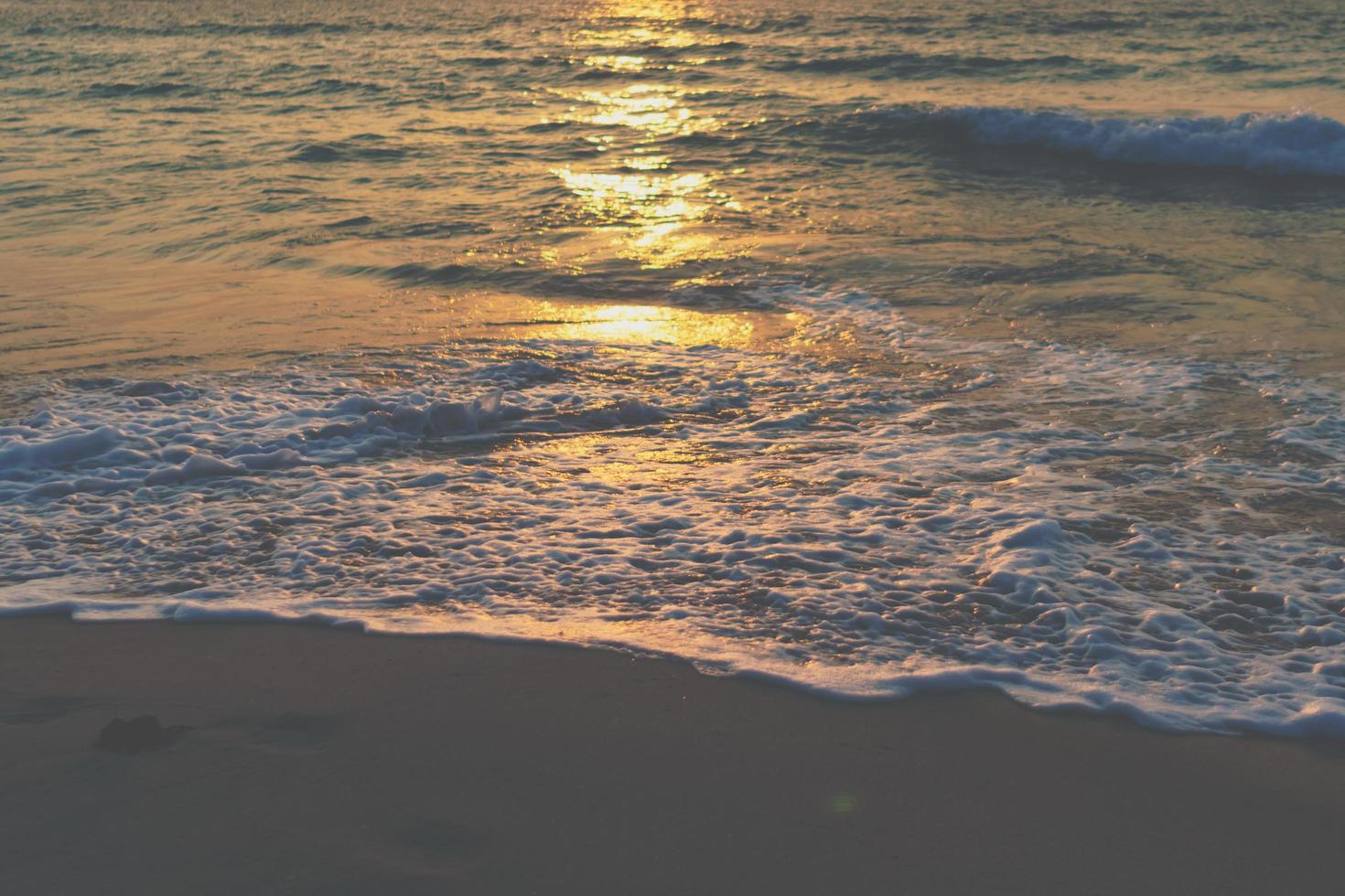 Colorful vibrant ocean sea waves at the beach during summer photo