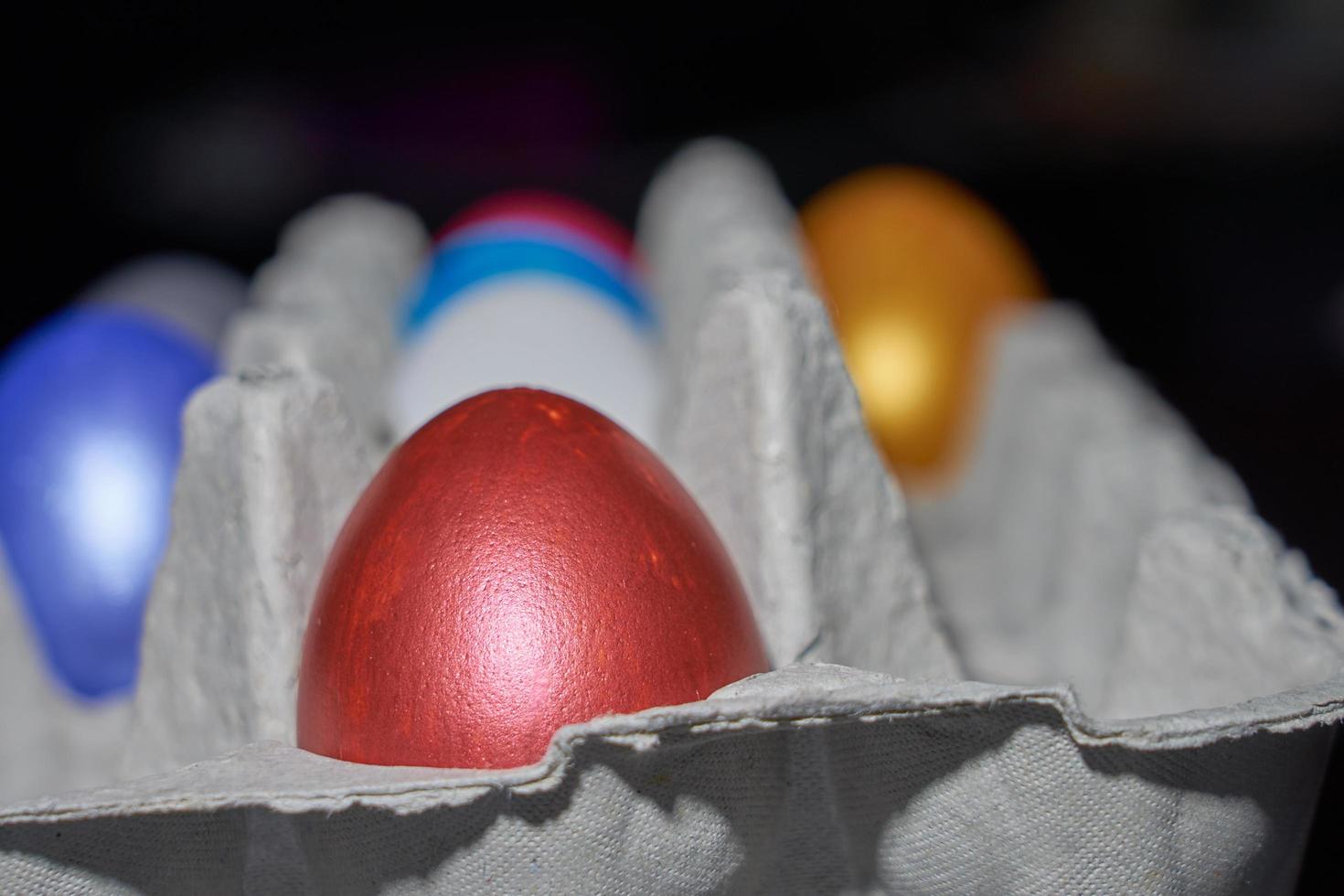 Close up of pearl-colored eggs for Easter in an egg tray photo