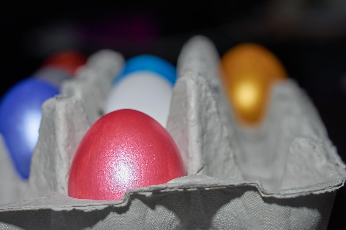 Close up of pearl-colored eggs for Easter in an egg tray photo
