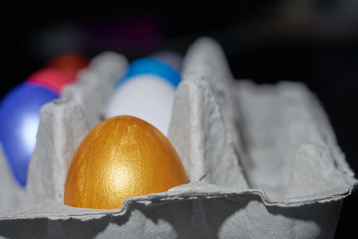 Close up of pearl-colored eggs for Easter in an egg tray photo