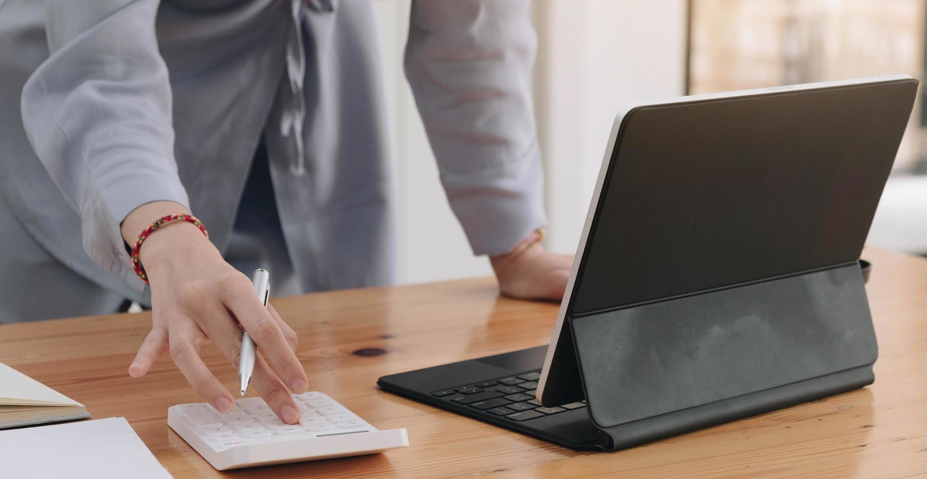 Person standing while working photo