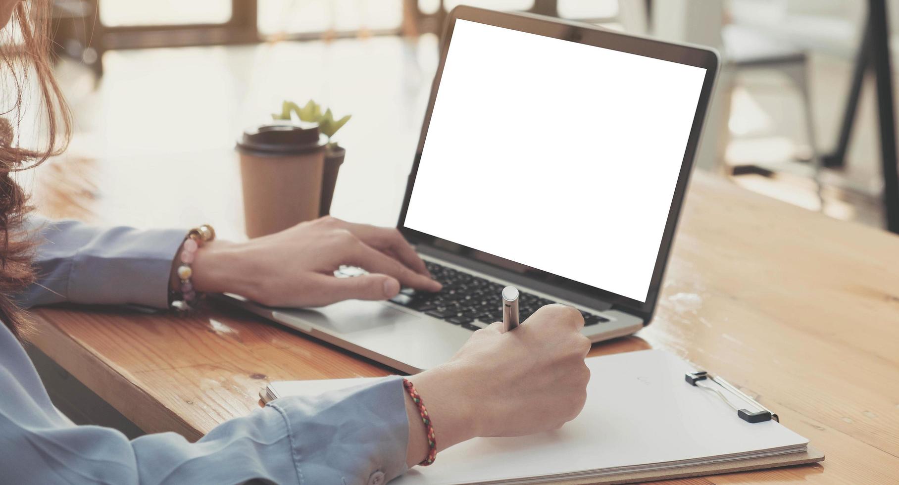 Person using a laptop mock-up photo