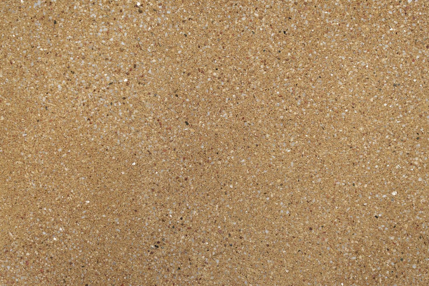 Brown wall of granite crumbs textured background photo