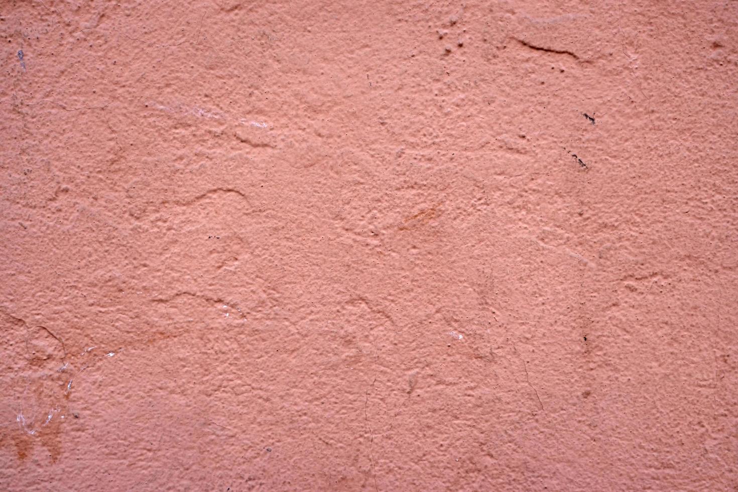 Painted pink wall textured background photo