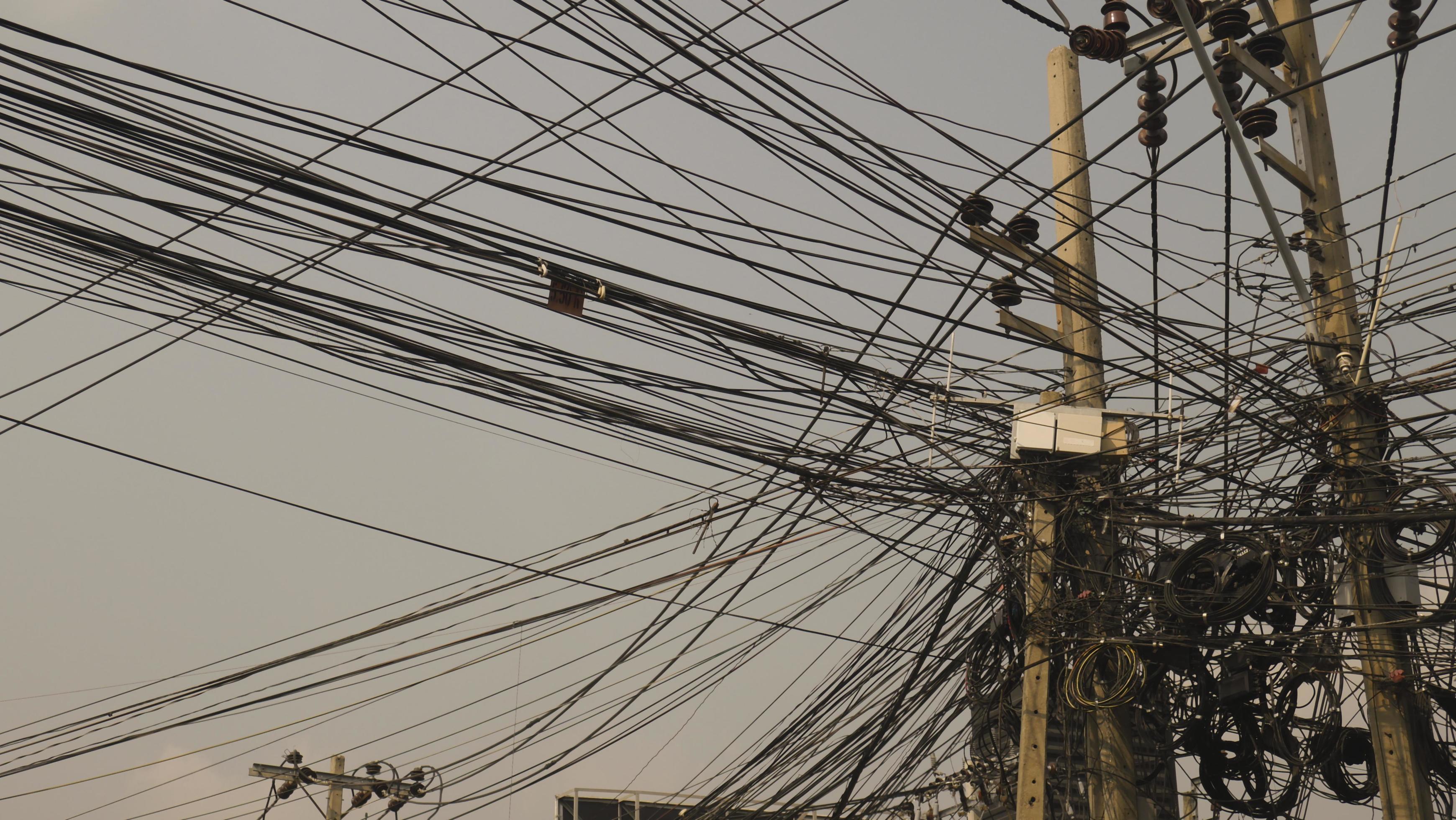 Cluttered communication lines on telephone poles 2191062 Stock Photo at
