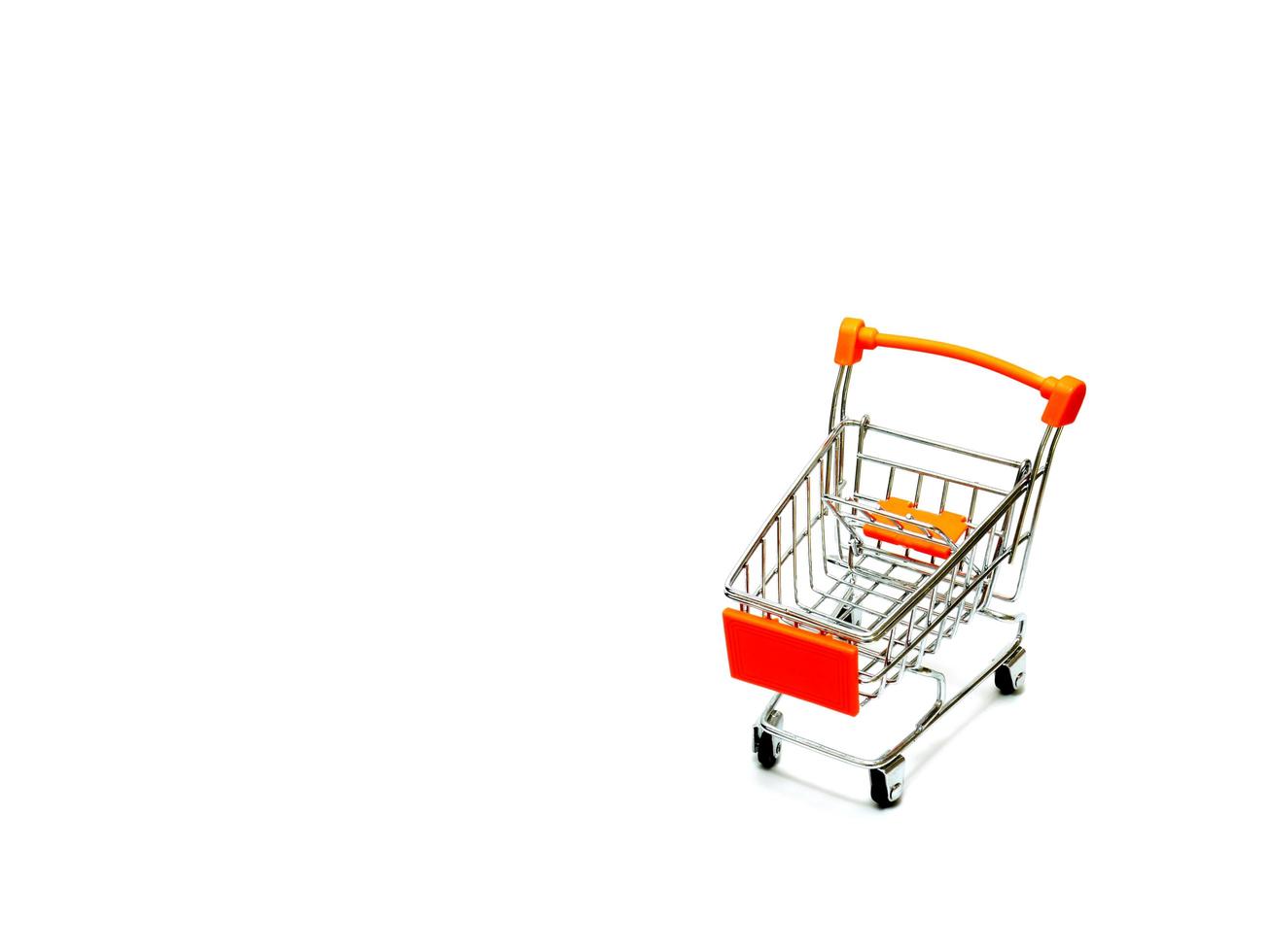 Mini shopping cart isolated on white background photo