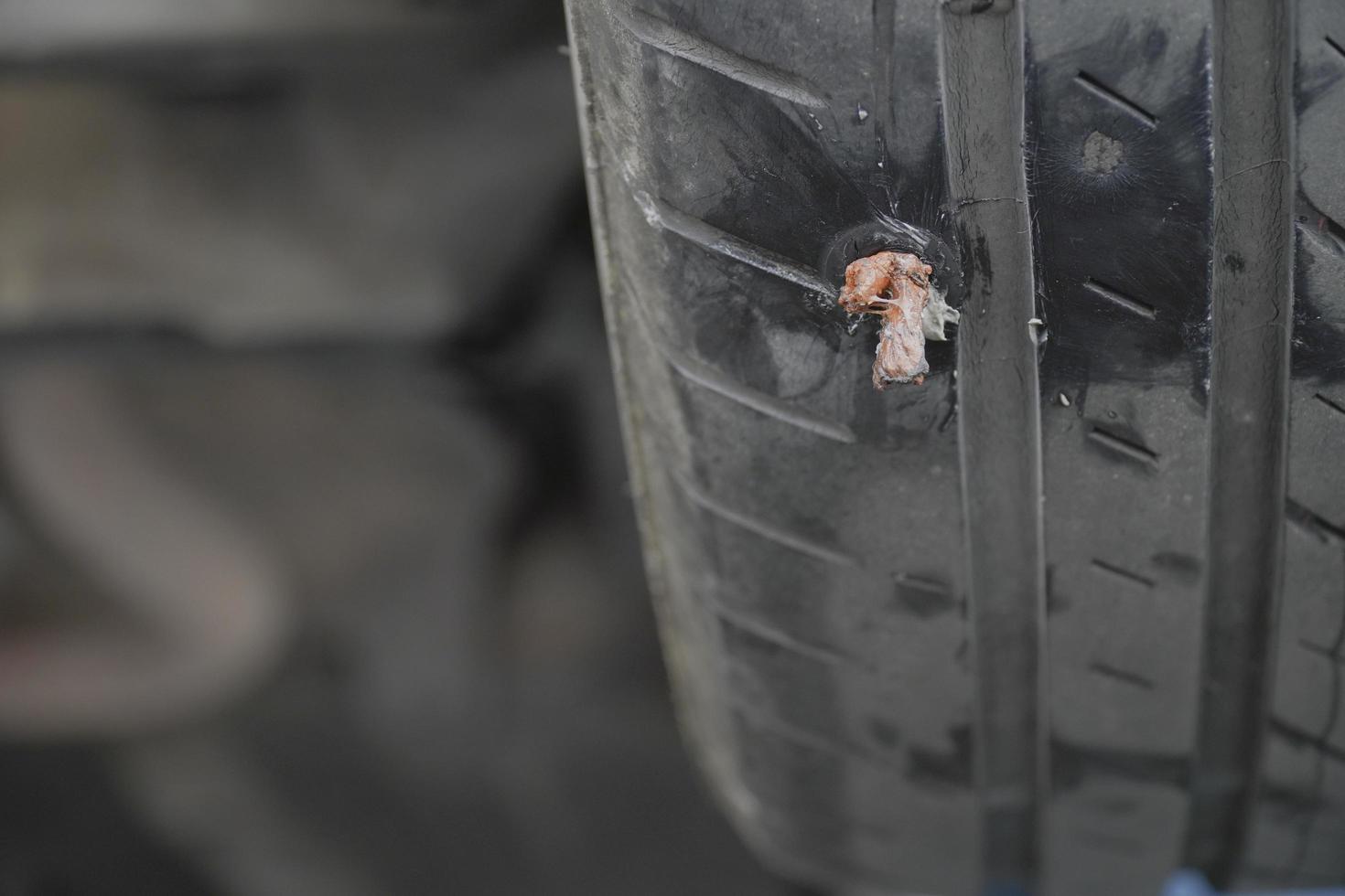 Close-up of a tire that has been repaired photo