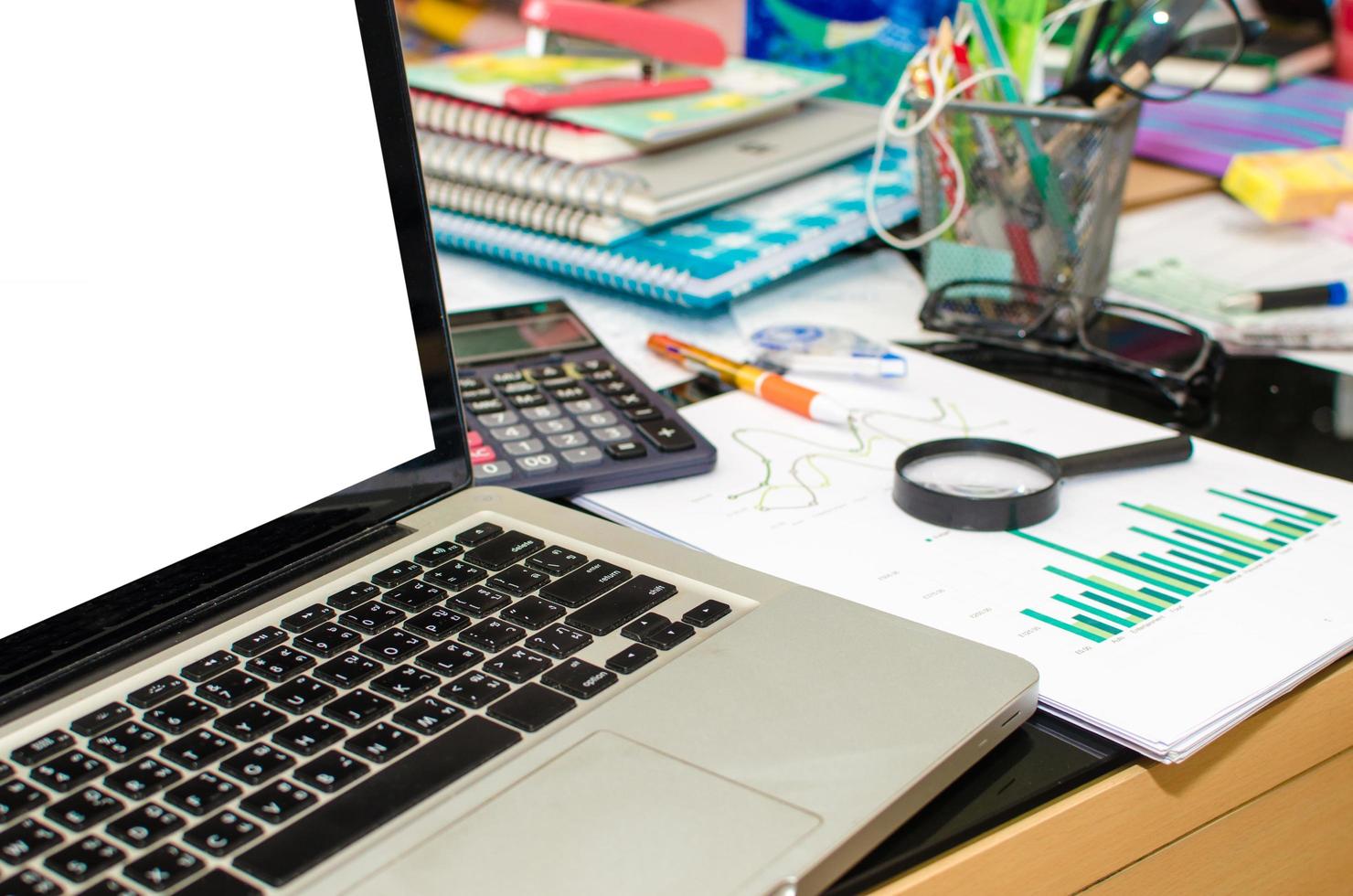 Laptop mock-up on a messy desk photo