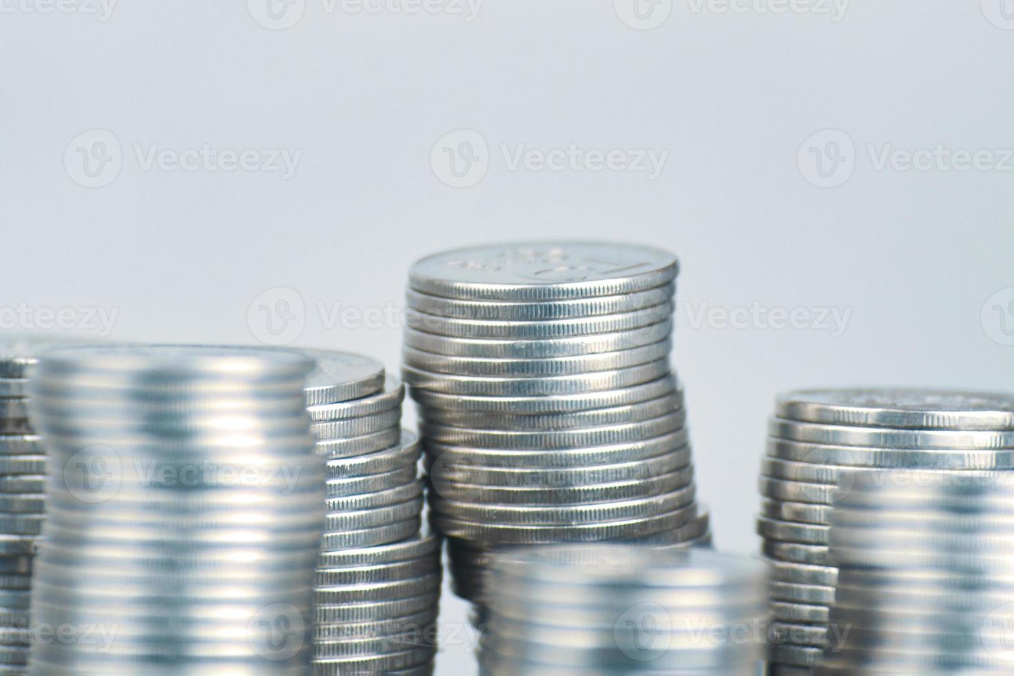 Stacks of silver coins on white background photo