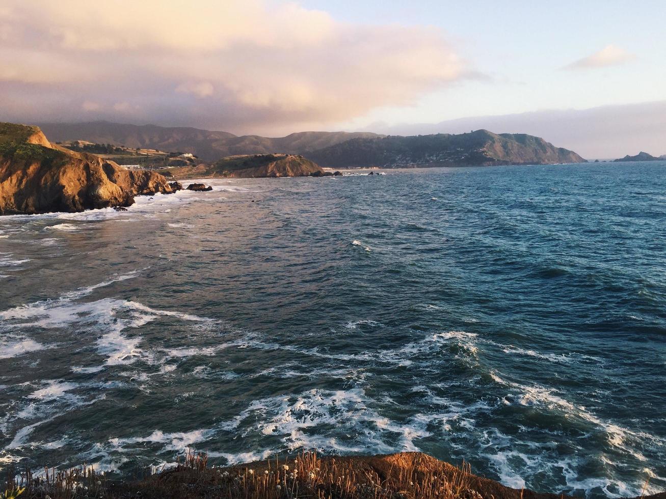 Rocky coastline, ocean view in California, USA photo
