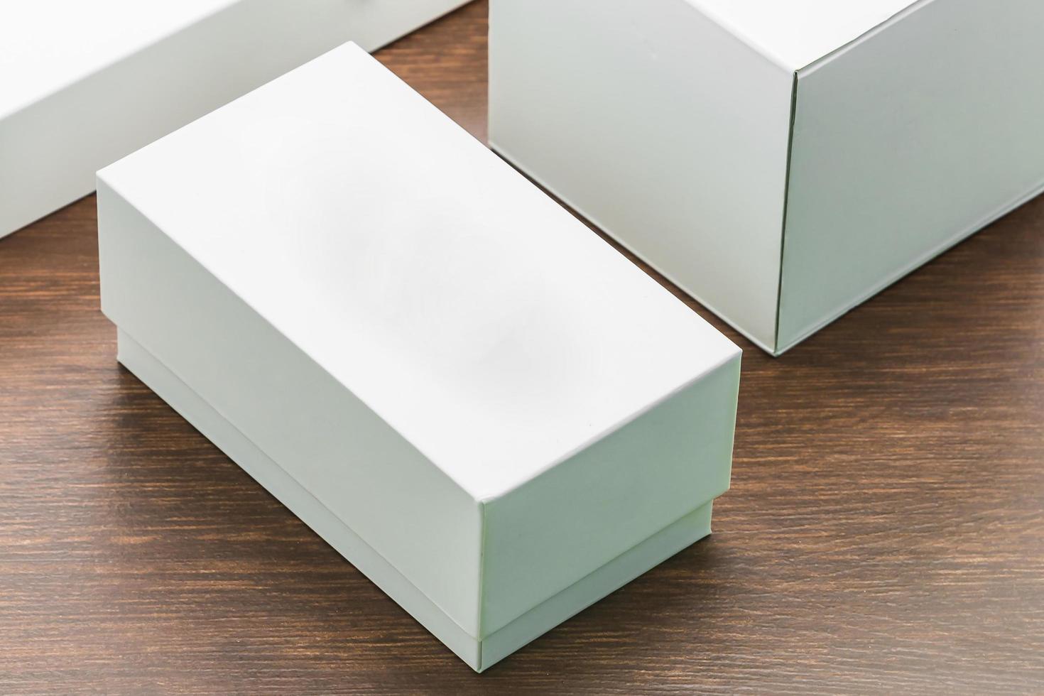 Blank box mock up on wooden background photo