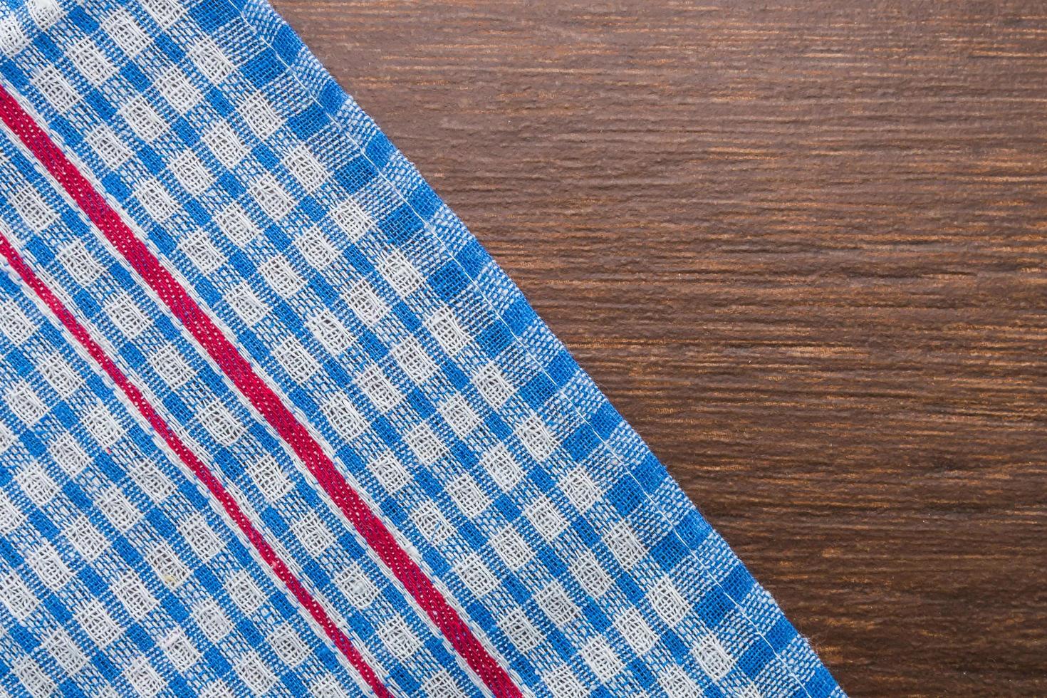 Tablecloth on wooden background photo