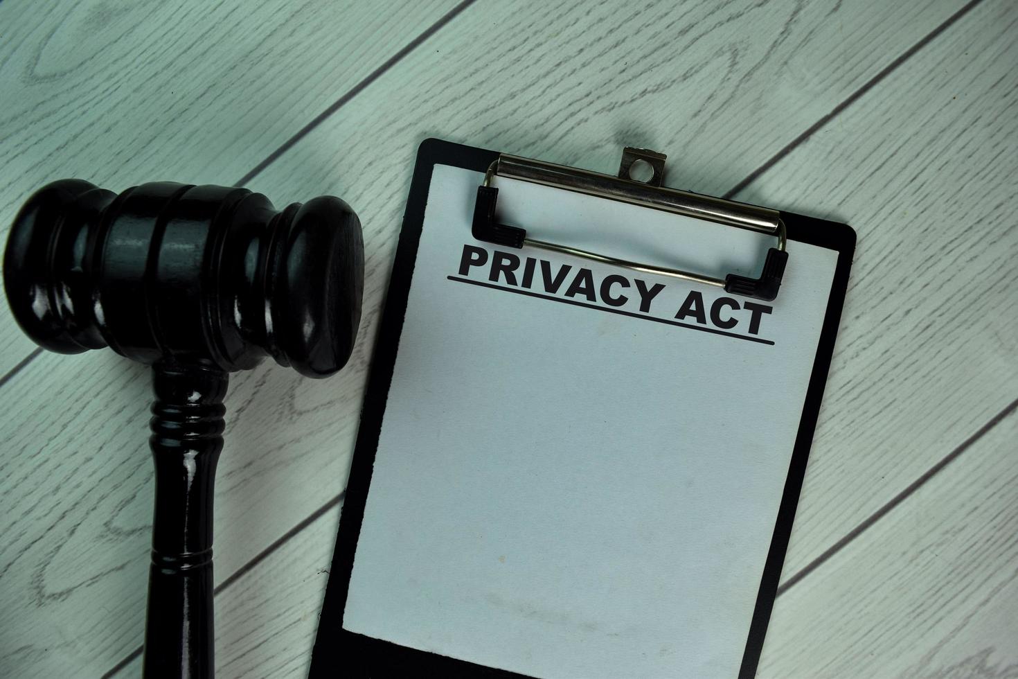 Privacy Act written on paperwork isolated on wooden table photo