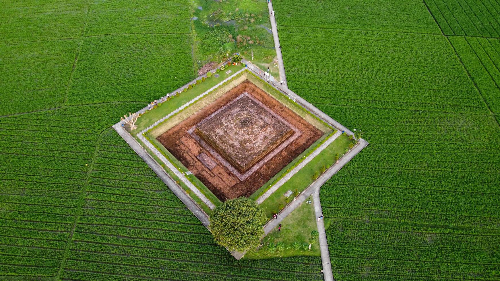 Karawang, Indonesia 2021- Aerial drone view of Blandongan Temple at Karawang and surrounded by green grass photo