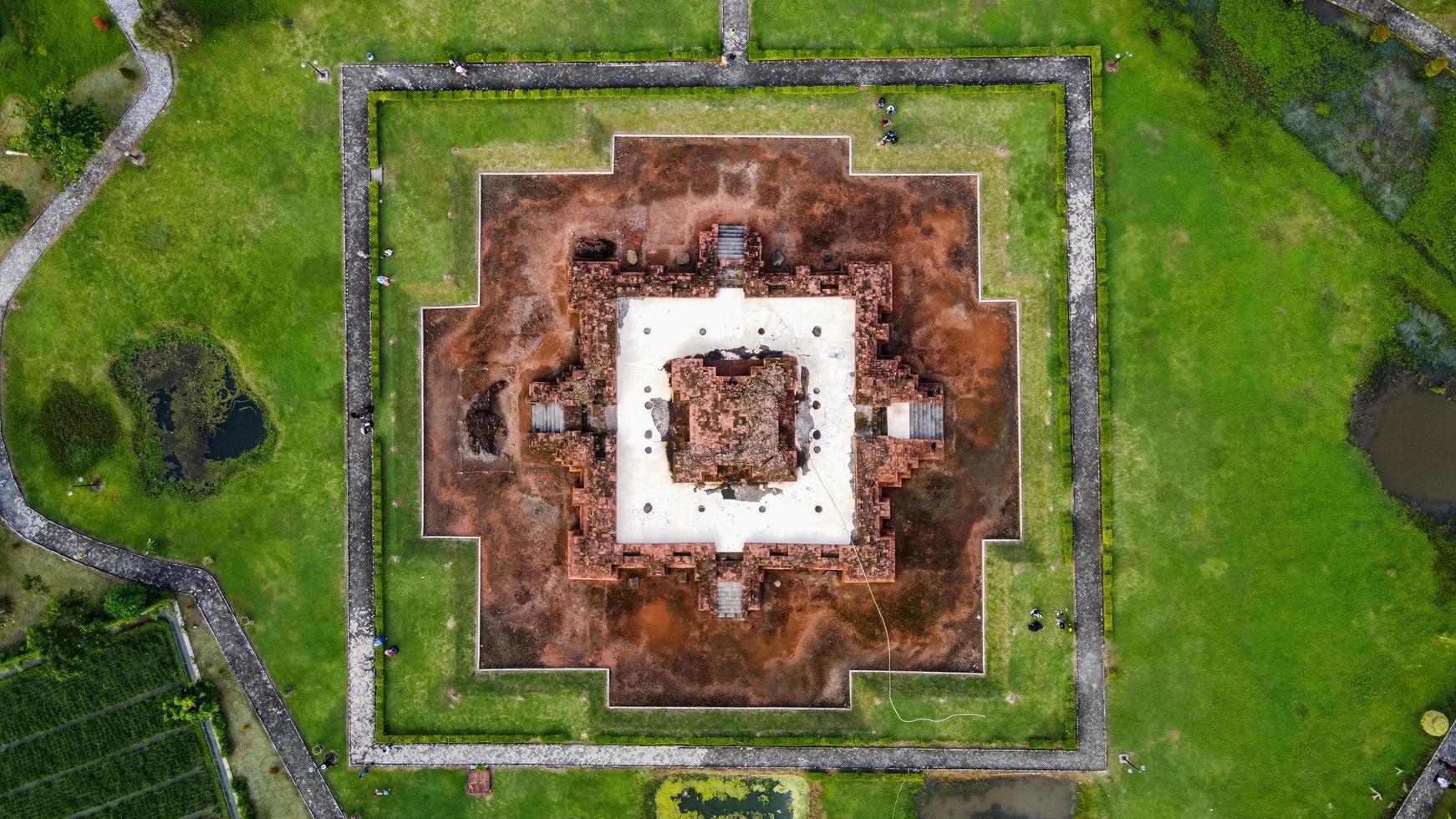 Karawang, Indonesia 2021- Aerial drone view of Blandongan Temple at Karawang and surrounded by green grass photo