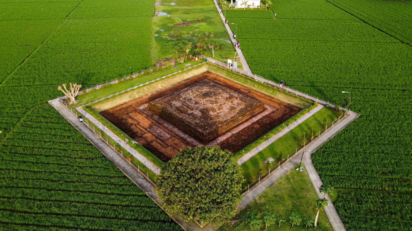 Karawang, Indonesia 2021- Aerial drone view of Blandongan Temple at Karawang and surrounded by green grass photo