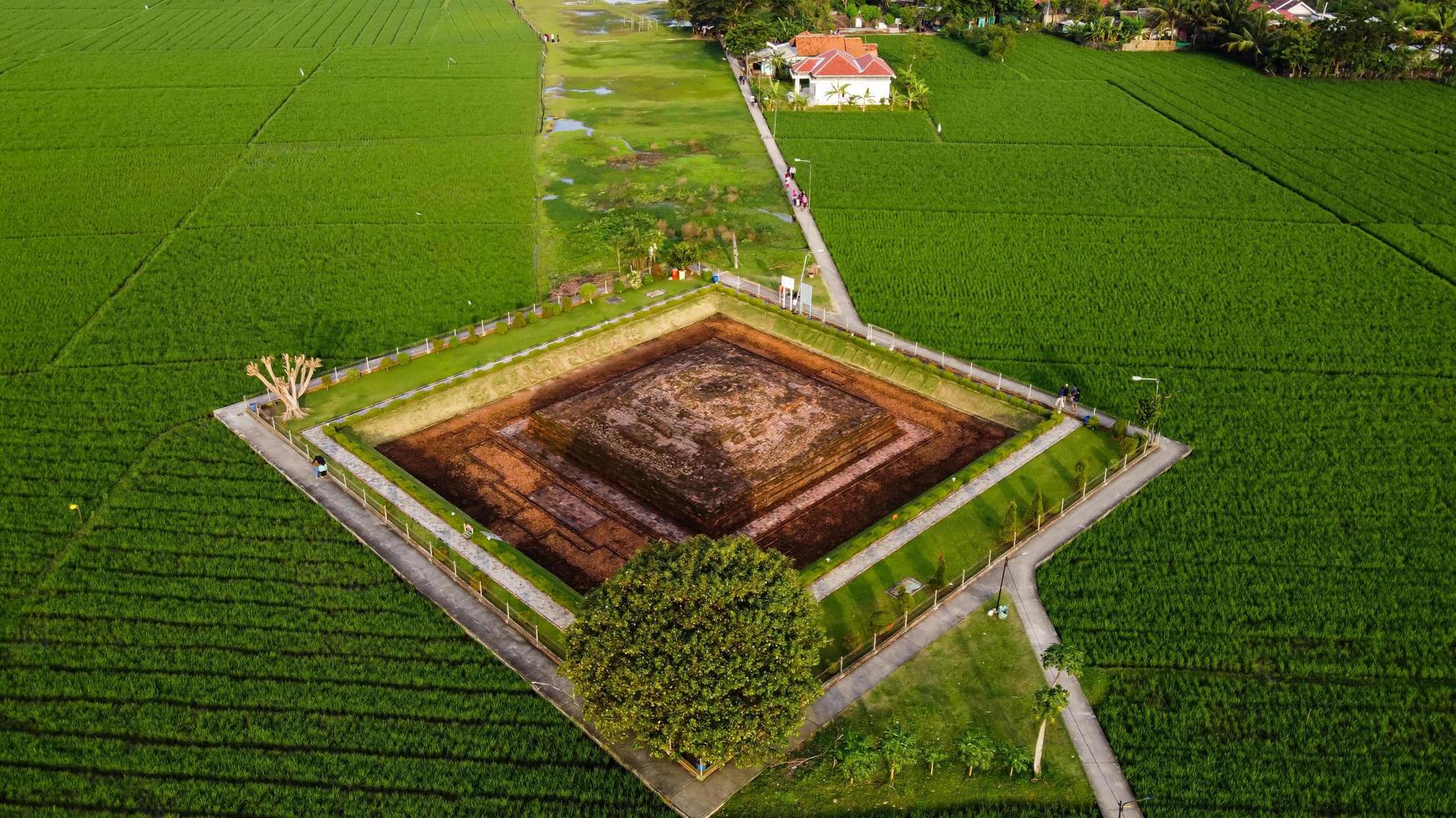 Karawang, Indonesia 2021- Aerial drone view of Blandongan Temple at Karawang and surrounded by green grass photo