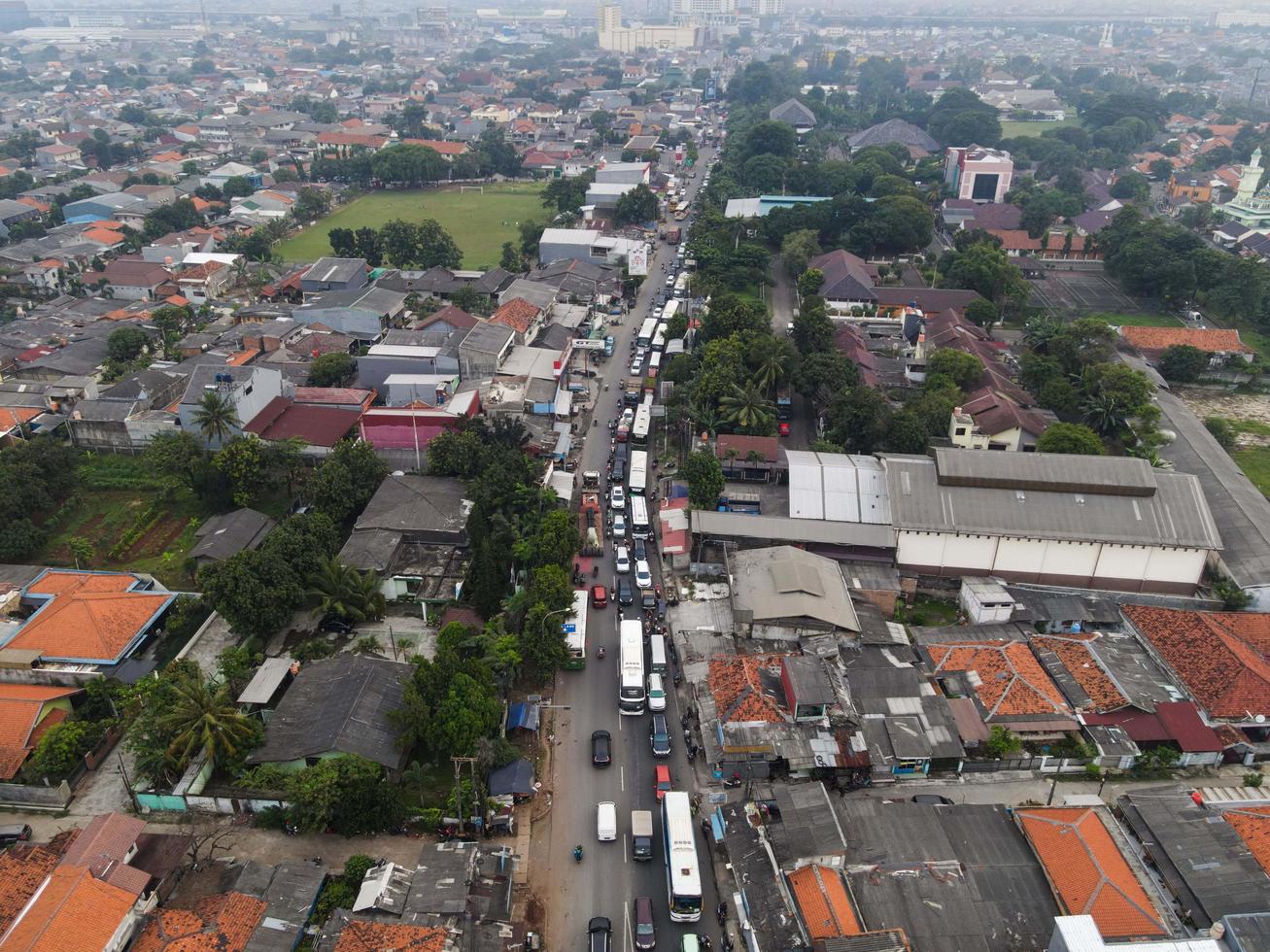 Bekasi, Indonesia 2021- Traffic jam on the polluted streets of Bekasi with the highest number of motor vehicles and traffic congestion photo