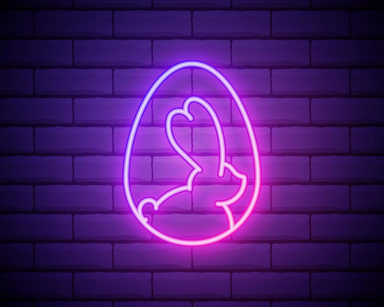 Easter Egg and Bunny Neon Label. Vector Illustration of Seasonal Holiday Promotion. Easter glowing neon isolated on brick wall