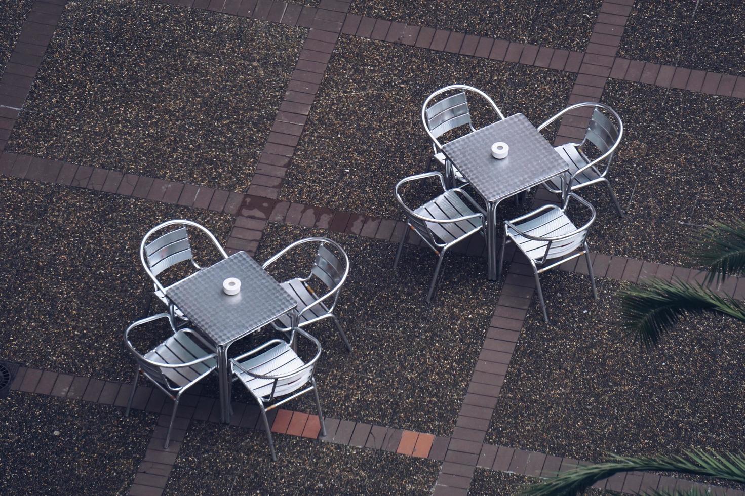 Metallic tables and chairs on the street photo