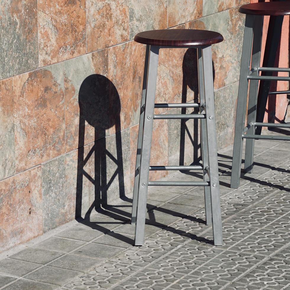 Metallic chairs on the street photo