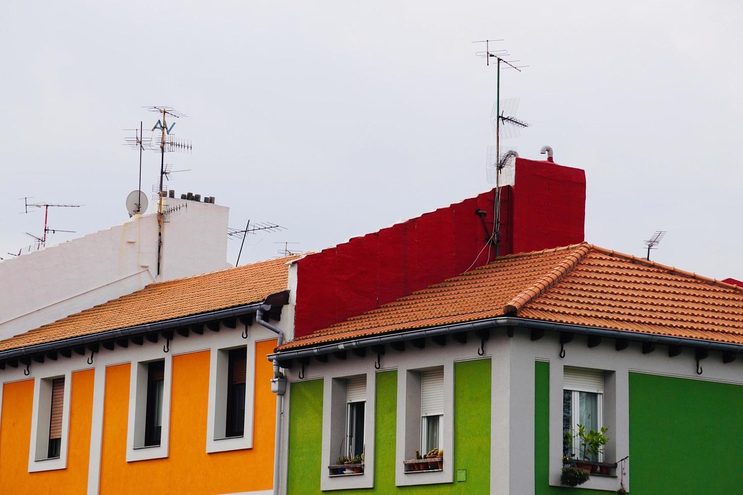 Antenna tv on the rooftop of a house photo