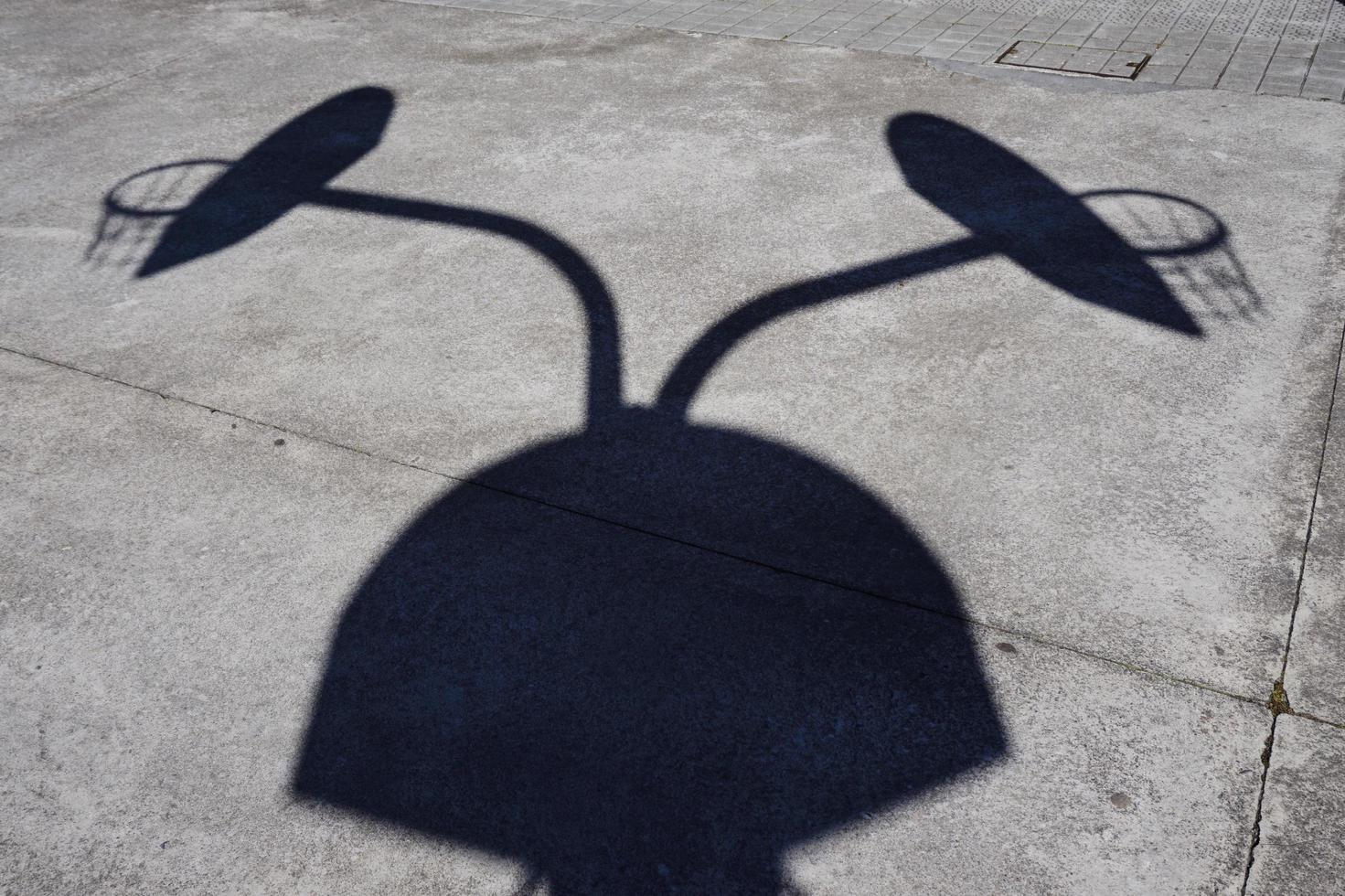 Street basketball hoop shadow silhouette on the court photo