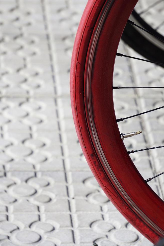 Bicycle wheel on the street photo