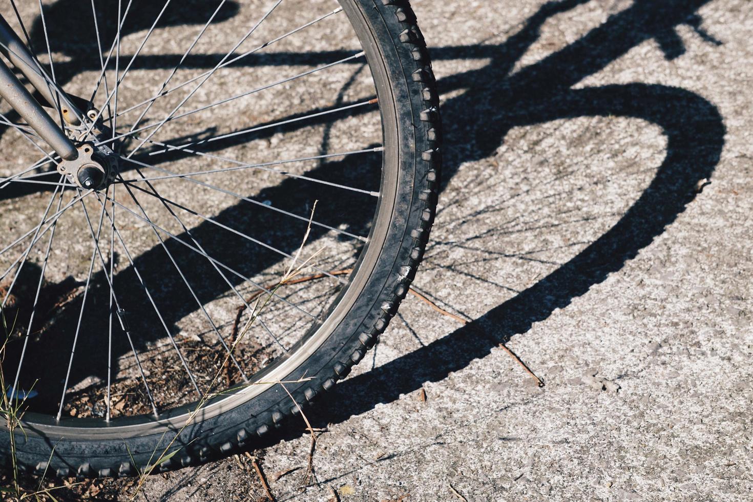 Bicycle shadow silhouette wheel on the street photo