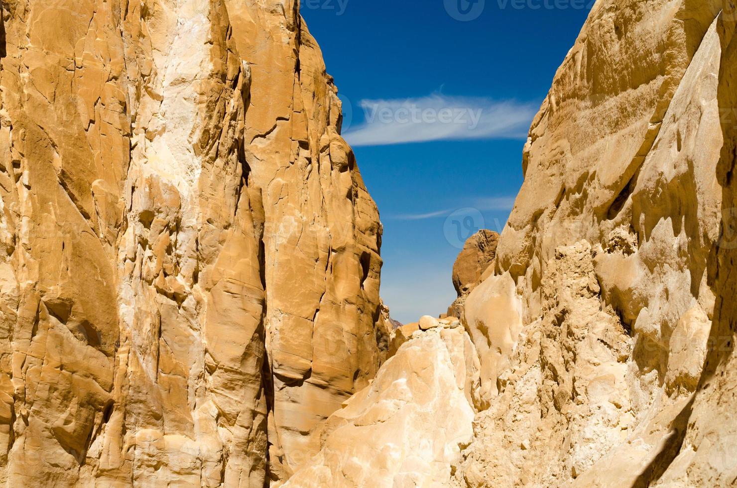 Blue sky between rocks photo