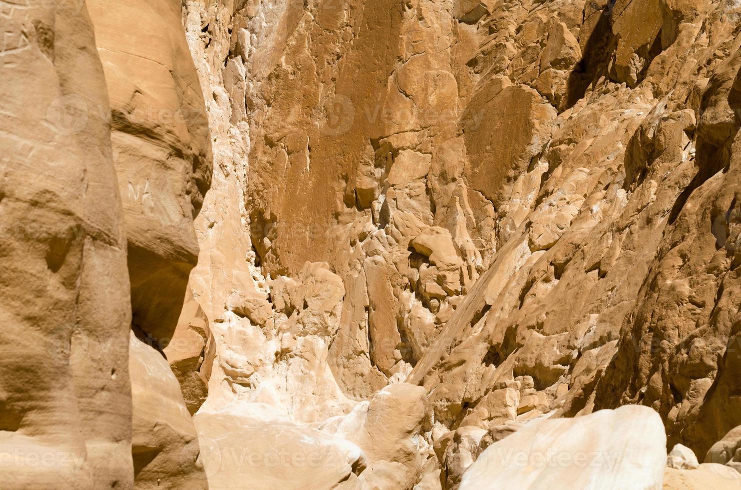 Rough rocky wall of a canyon photo
