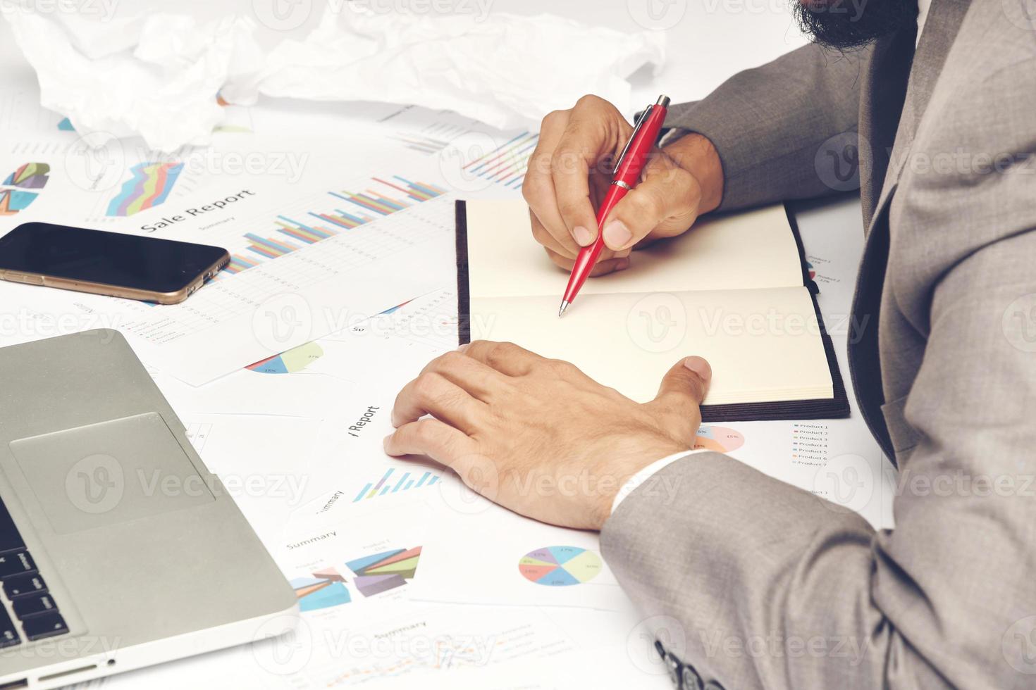 Business person writing in a notebook photo