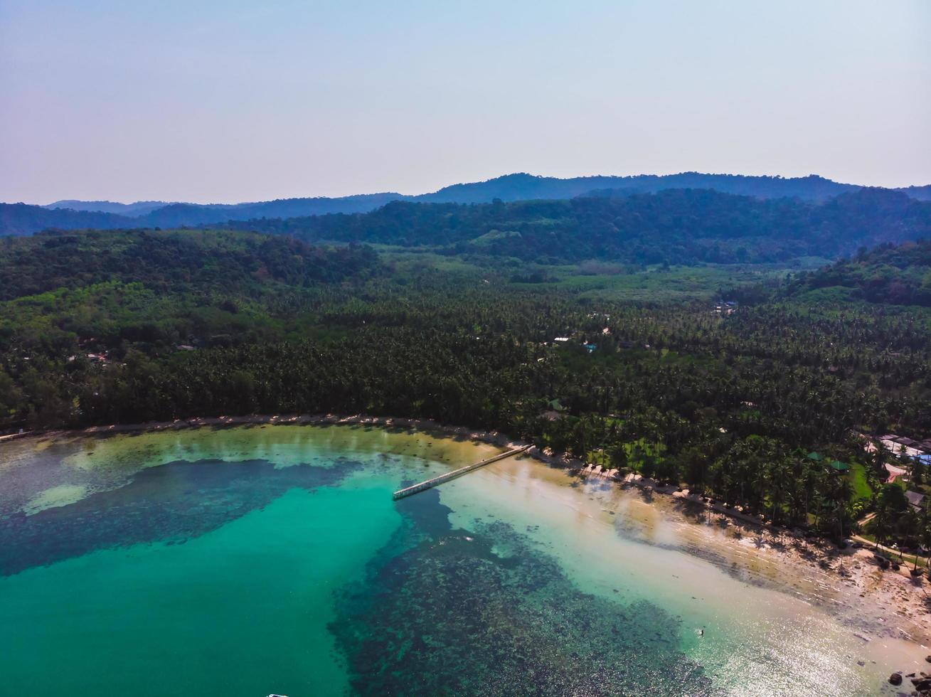 Aerial view of beautiful beach and sea with coconut palm tree photo