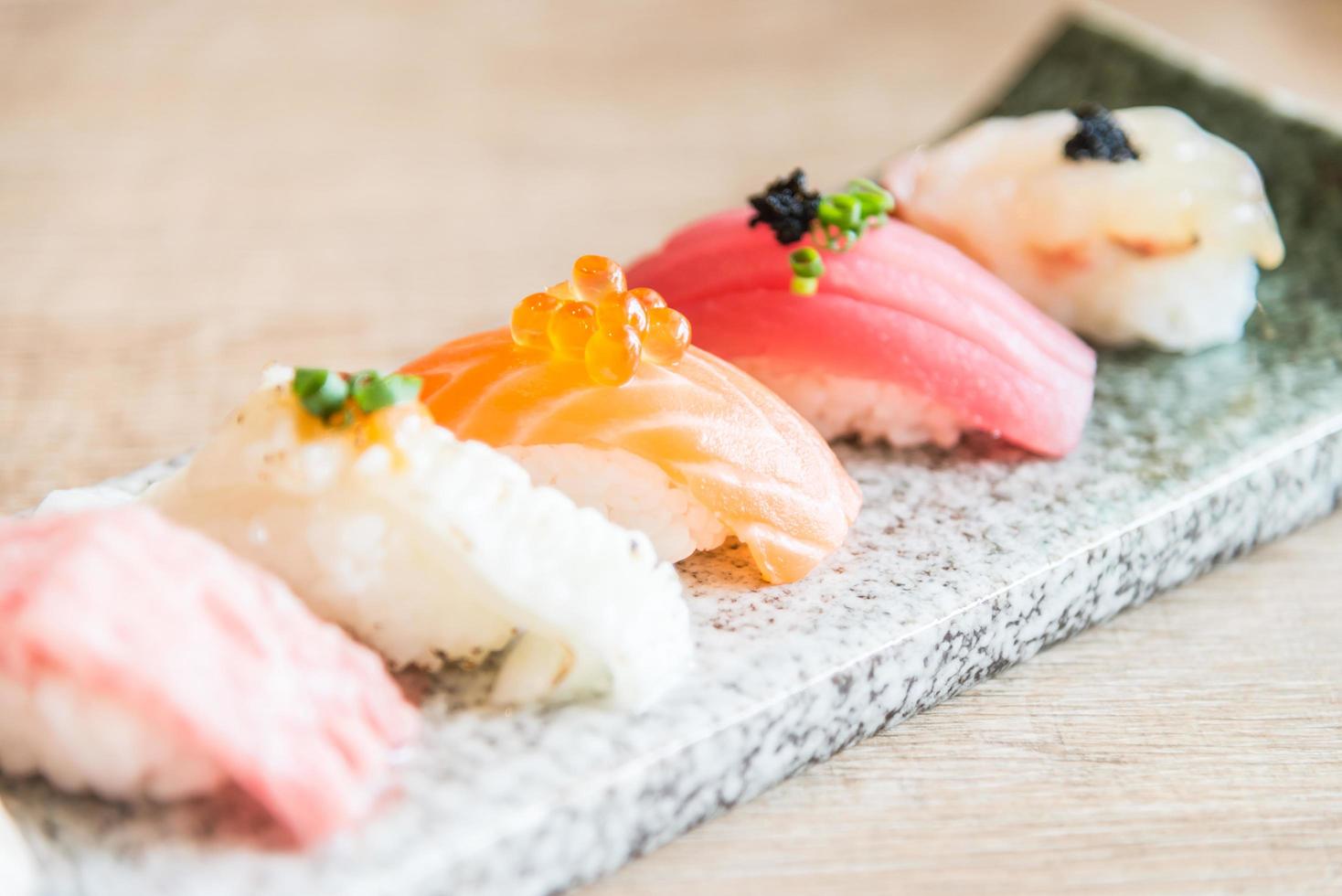 Selective focus point on sushi roll photo. 