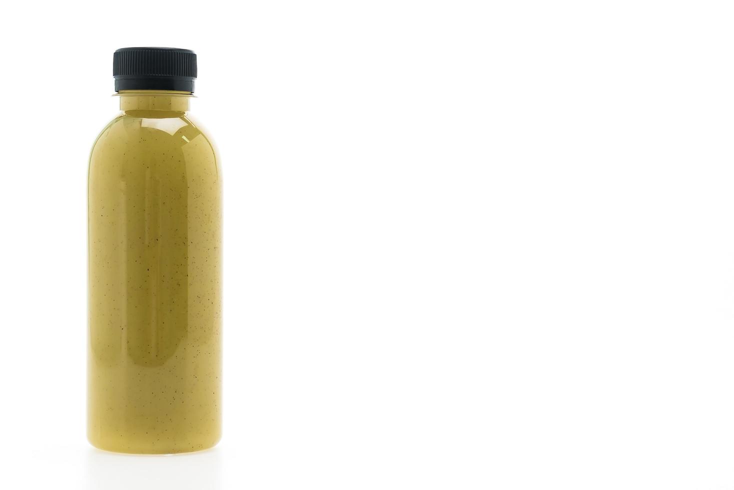 Kiwi juice bottle isolated on white background photo