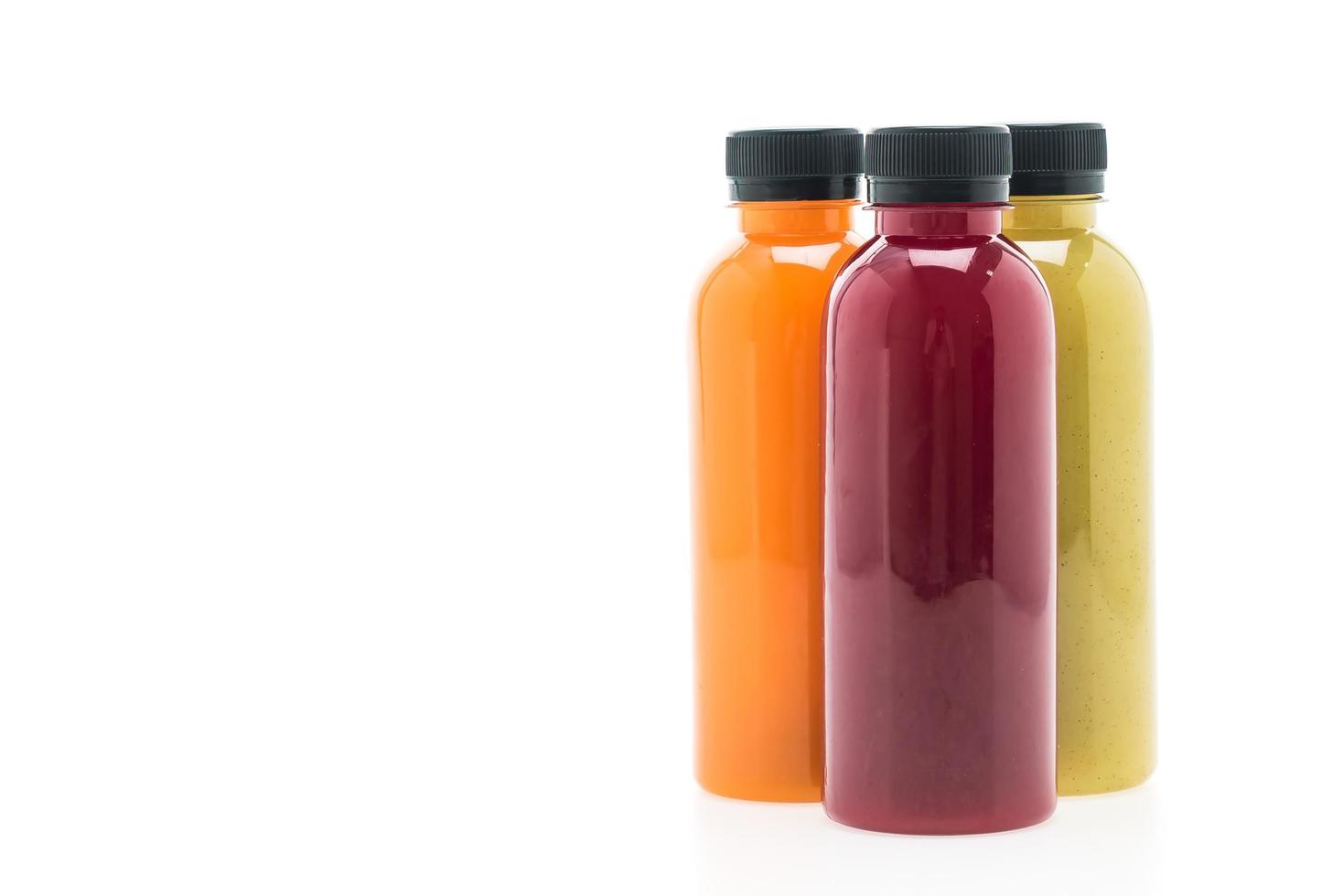 Fruit and vegetable juice bottles isolated on white background photo