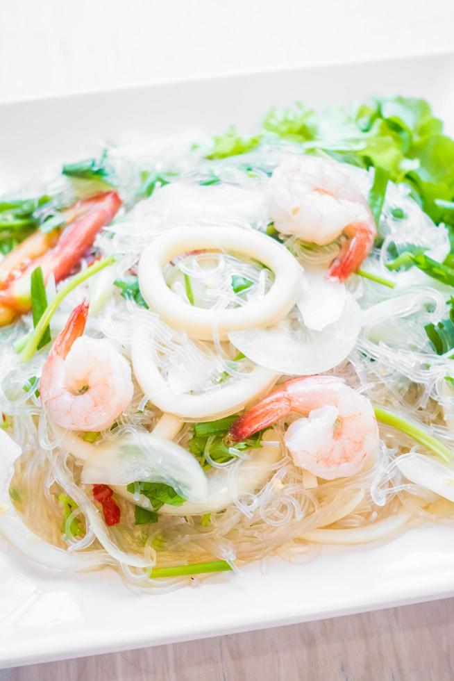 Spicy salad with seafood photo