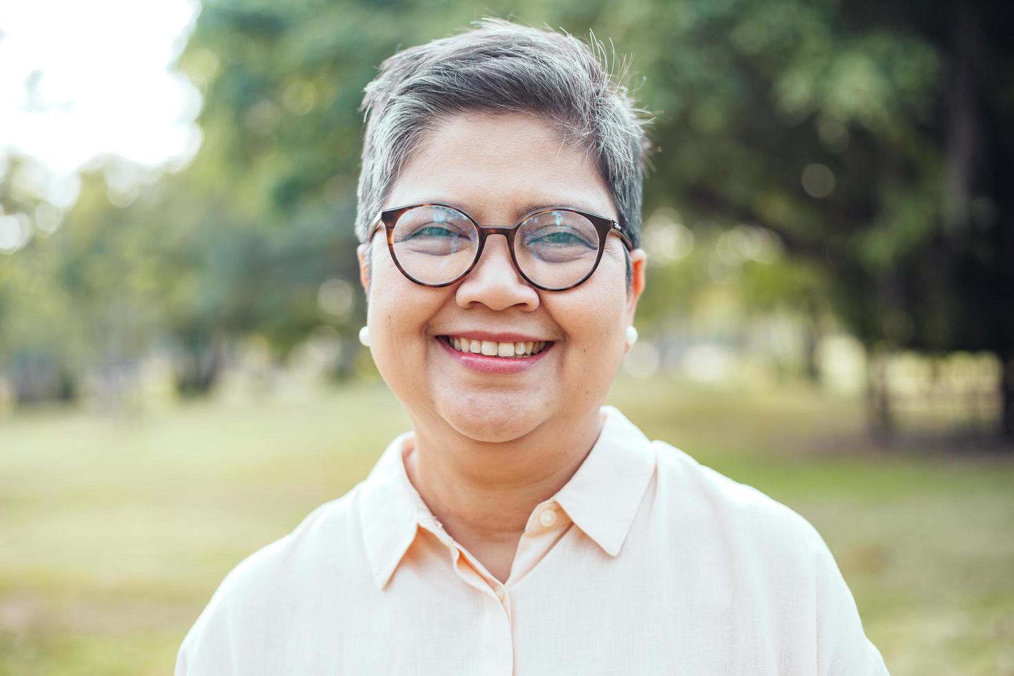 Close-up portrait of a mature woman outside photo