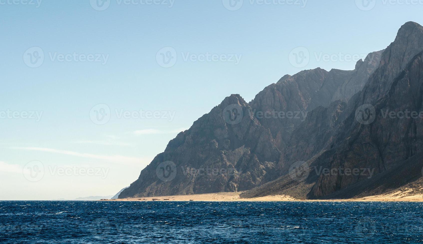 Mountains near the shore photo