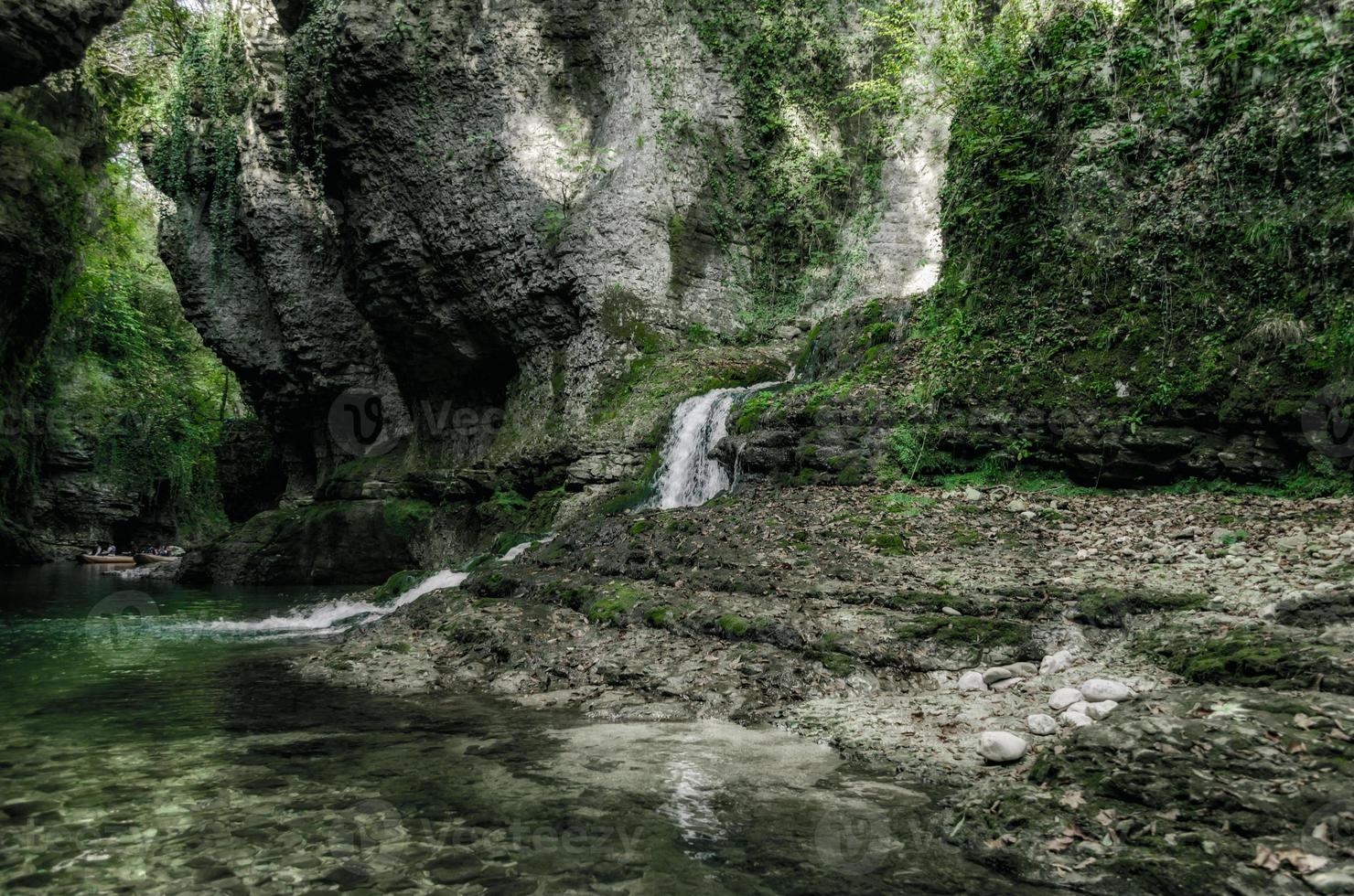 Small waterfall leading to a stream photo