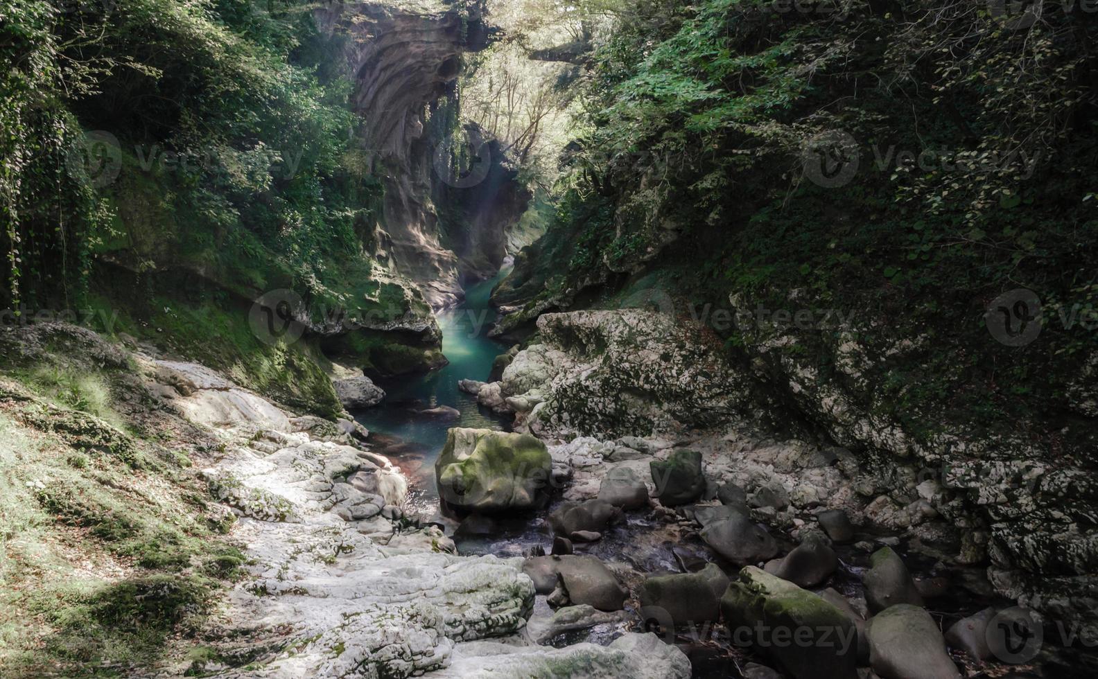 Stream running through rocks photo