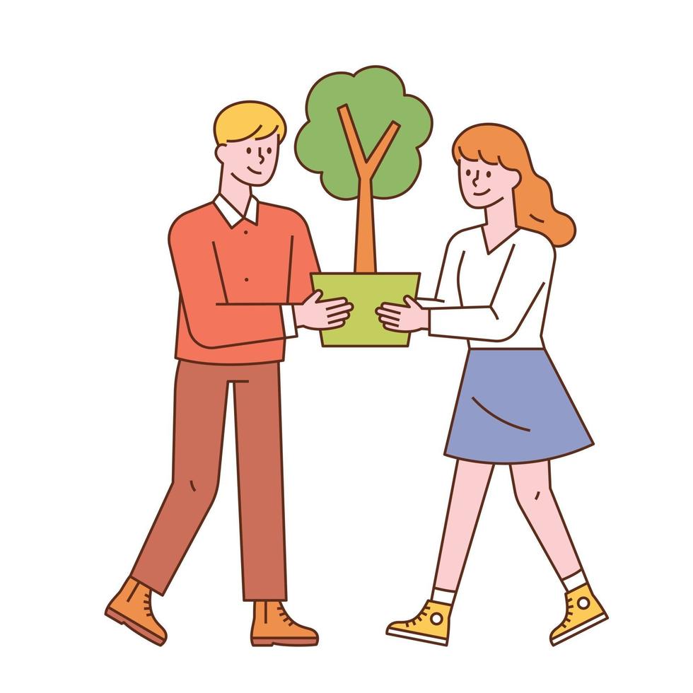 A man and a woman are holding a flower pot together. vector